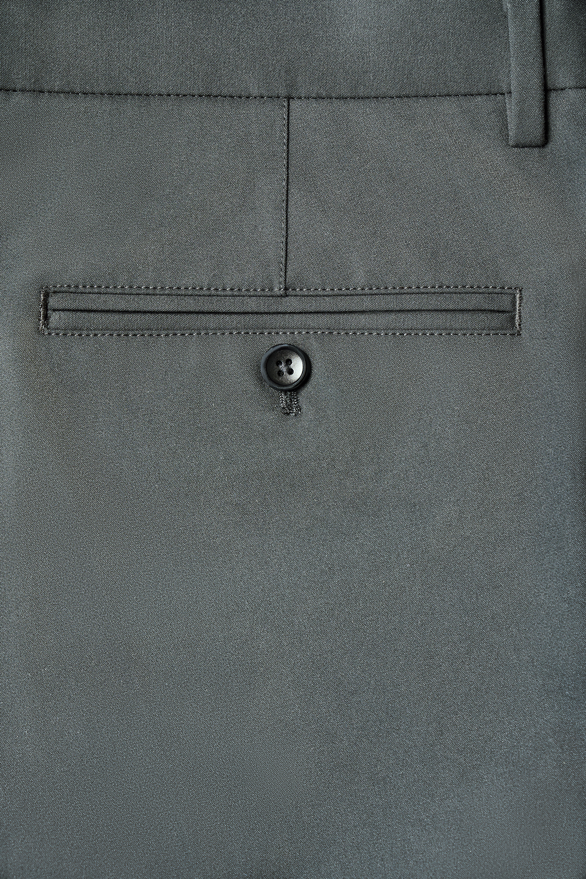 Charcoal dress pants crafted from Yarn-dyed Cotton Herringbone Fabric for a refined look and lasting durability